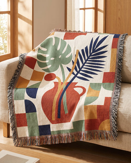Still Life No.1 throw draped over a linen sofa